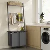A laundry room with a ladder shelf unit, a washing machine, and cabinets. Produktbild-Vorschau