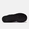 The sole of a black sneaker is shown against a white background. Voir les images du produit