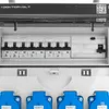Close-up view of an electrical distribution box with circuit breakers and outlets. Produktbild-Vorschau
