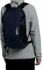 A person wearing a gray hoodie and black pants, with a navy blue backpack on their back. Produktbild-Vorschau