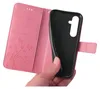 A hand holding a pink flip phone case open to reveal the black inner shell. Produktbild-Vorschau