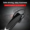 A close-up of a black Bluetooth headset with a car in the background. Produktbild-Vorschau