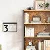 A rustic wooden bookshelf filled with books and decorative items, next to a wall with a modern calendar. Anteprima dell’immagine prodotto