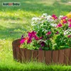 A wooden garden border filled with colorful flowers and greenery. Produktbild-Vorschau