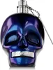 A skull-shaped perfume bottle with a metallic, iridescent finish. Podgląd zdjęcia produktu