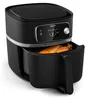 A black Philips air fryer with a chicken inside the basket, placed on a white background. Podgląd zdjęcia produktu