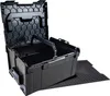 A black tool box with its lid open, sitting on a black textured mat. Podgląd zdjęcia produktu