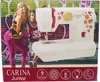The image shows the packaging of a CARINA Junior sewing machine, featuring a graphic of two people in athletic wear against a graffiti-style background. The sewing machine itself is prominently displayed on the front of the packaging. Produktbild-Vorschau