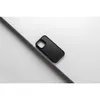 A black phone case is placed diagonally on a white and gray surface. Anteprima dell’immagine prodotto