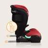 Side view of a red and black child car seat with an ISOfix indicator. Produktbild-Vorschau