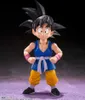 A studio shot of a Dragon Ball GT Son Goku action figure against a dark background with a purple textured floor. Náhled obrázku produktu