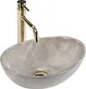 A close-up studio shot of a grey oval basin with gold faucet. Podgląd zdjęcia produktu
