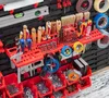 A well-organized tool wall with various tools and storage bins. Produktbild-Vorschau