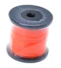 A spool of orange trimmer line on a black spool, wrapped in clear plastic. Anteprima dell’immagine prodotto