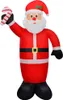 An inflatable Santa Claus holding a candy cane. Náhľad obrázku produktu