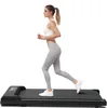 A woman is running on a treadmill. Produktbild-Vorschau