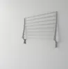 A wall-mounted drying rack is shown against a white wall. Produktbild-Vorschau