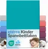 A stack of colorful fitted sheets with a child sleeping on a pillow in the foreground. Náhľad obrázku produktu