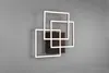 A modern wall lamp with three overlapping square frames, mounted on a gray wall. Náhľad obrázku produktu