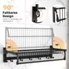 Collage showing a black metal wall-mounted shelf unit with hooks and a towel bar, illustrating its folding design and 90-degree angle functionality. Produktbild-Vorschau
