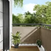 A balcony with a taupe privacy screen, wooden floor, and potted plants. Voir les images du produit