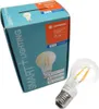 A product box for a smart LED light bulb, with the bulb itself placed next to it. Produktbild-Vorschau