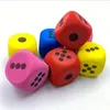 A collection of colorful dice scattered on a white background. Produktbild-Vorschau
