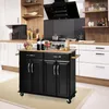 A black kitchen cart with a wooden countertop is placed in a modern kitchen setting. Náhľad obrázku produktu