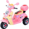 A pink and yellow toy electric scooter for children, shown from a three-quarter angle against a white background. Náhled obrázku produktu