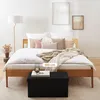 A bedroom scene with a bed and a storage bench in the foreground. Anteprima dell’immagine prodotto