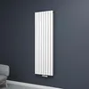 A white vertical radiator mounted on a dark gray wall, with a sliver of a gray armchair visible in the bottom left corner. Produktbild-Vorschau