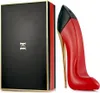 A perfume bottle shaped like a red high-heeled shoe and its packaging are displayed against a white background. Produktbild-Vorschau