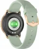 The back of a smartwatch with a green band and gold accents. Voir les images du produit