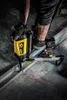 A person is using a DeWalt nail gun to fasten metal framing. Produktbild-Vorschau