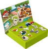 A magnetic playset with farm-themed pieces laid out on a green box and a backdrop. Podgląd zdjęcia produktu