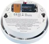 The underside of a white smoke detector with batteries installed and text labels. Voir les images du produit