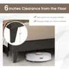 A close-up view of the underside of a bed frame, showing the clearance from the floor and a robot vacuum cleaner. Náhled obrázku produktu