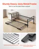 A black metal twin-size daybed with a pull-out trundle bed is shown in a bedroom setting next to a white nightstand. Voir les images du produit