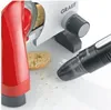 A close-up shot of a GRAEF brand food slicer and a handheld vacuum cleaner, with bread crumbs scattered on a white surface. Podgląd zdjęcia produktu