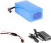 A blue battery pack, a charging cable, and a power adapter are displayed against a white background. Produktbild-Vorschau