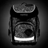 A black backpack with a reflective dot pattern, standing against a gradient background. Produktbild-Vorschau