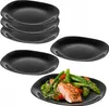 A stack of black plates and one plate with food on it. Anteprima dell’immagine prodotto