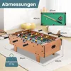 A foosball table is shown in a room with other toys and furniture. Dimensions are overlaid on the image. Produktbild-Vorschau