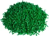 A pile of small green plastic plant pieces. Produktbild-Vorschau