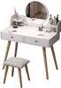 A white vanity table with a round mirror and a stool, set against a white background. Podgląd zdjęcia produktu