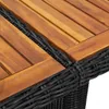 A close-up view of the corner of a table, showing the woven rattan base and the wooden tabletop. Náhľad obrázku produktu