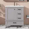 A bathroom vanity cabinet with a ceramic sink and faucet, set against a pink wall with palm leaf shadows and a patterned floor. Anteprima dell’immagine prodotto