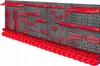 A wall-mounted tool organization system with various red holders and bins against a gray pegboard. Produktbild-Vorschau