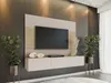 A modern living room setup featuring a wall-mounted TV unit with integrated storage and decorative elements. Produktbild-Vorschau
