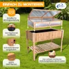 A wooden raised garden bed with a greenhouse lid, shown outdoors on grass, with instructional callouts. Produktbild-Vorschau